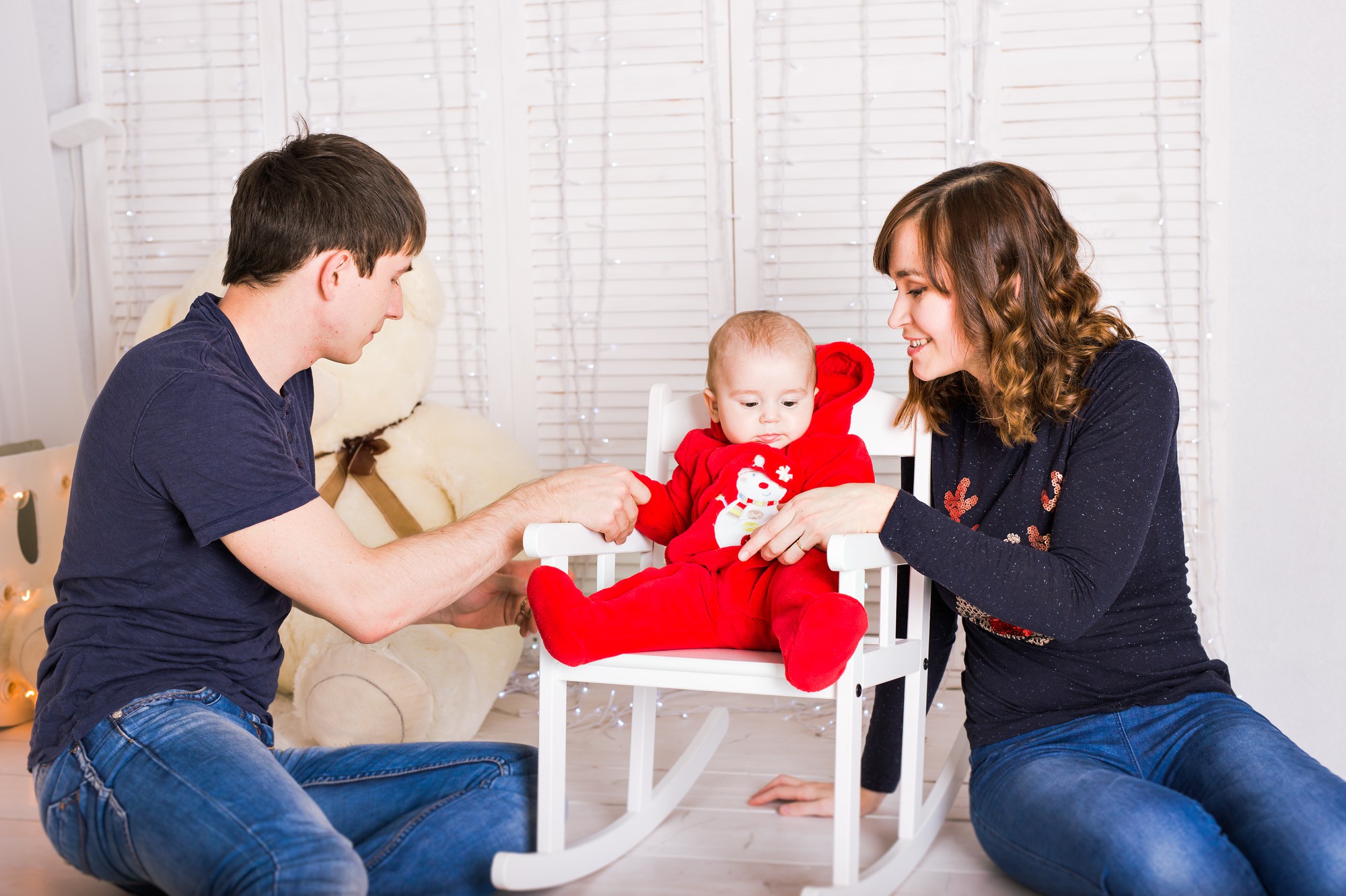 Parent checking baby for emergency warning signs with medical decision-making guide