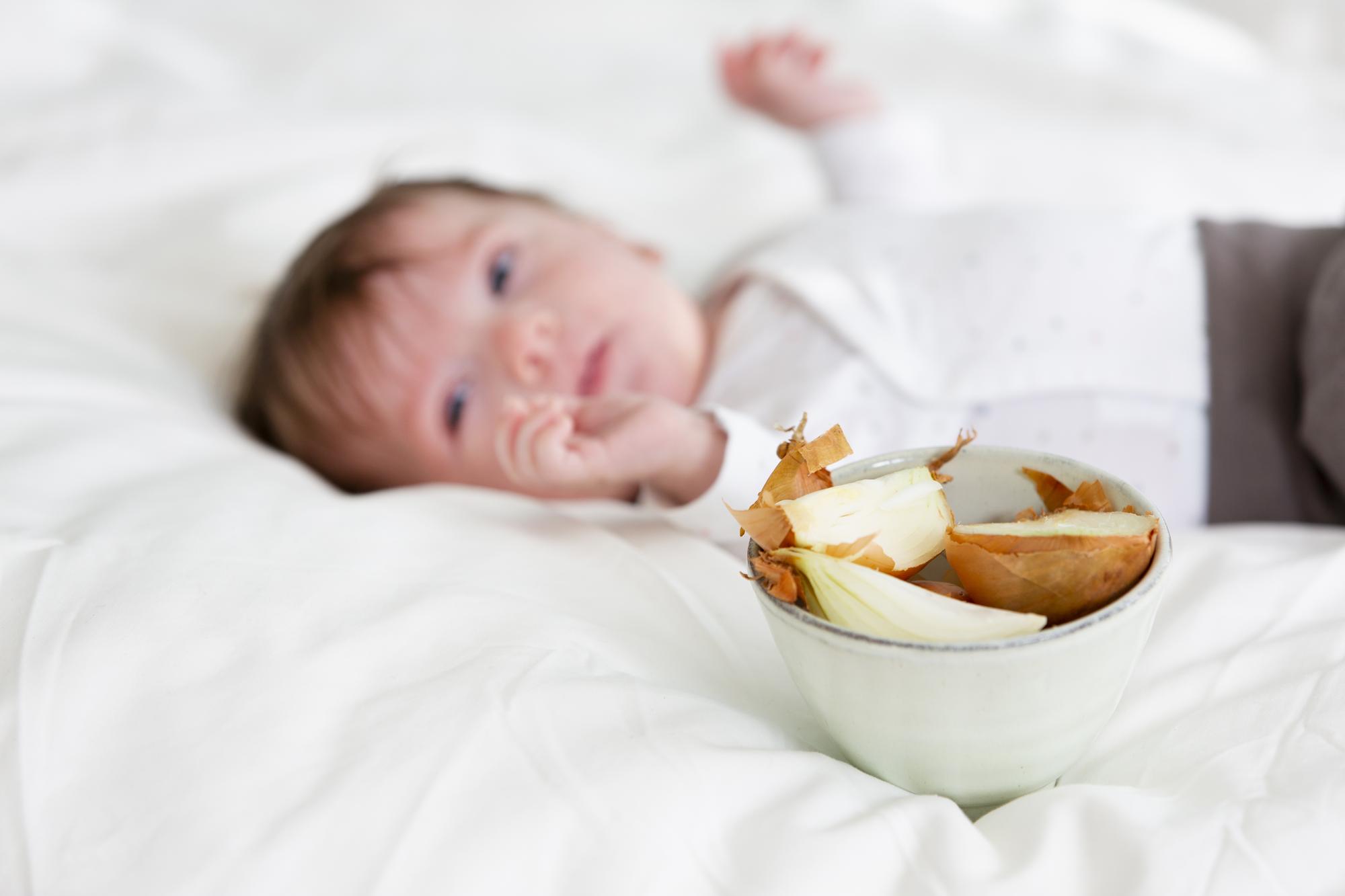 Peaceful newborn baby sleeping contentedly after feeding, showing signs of adequate nutrition